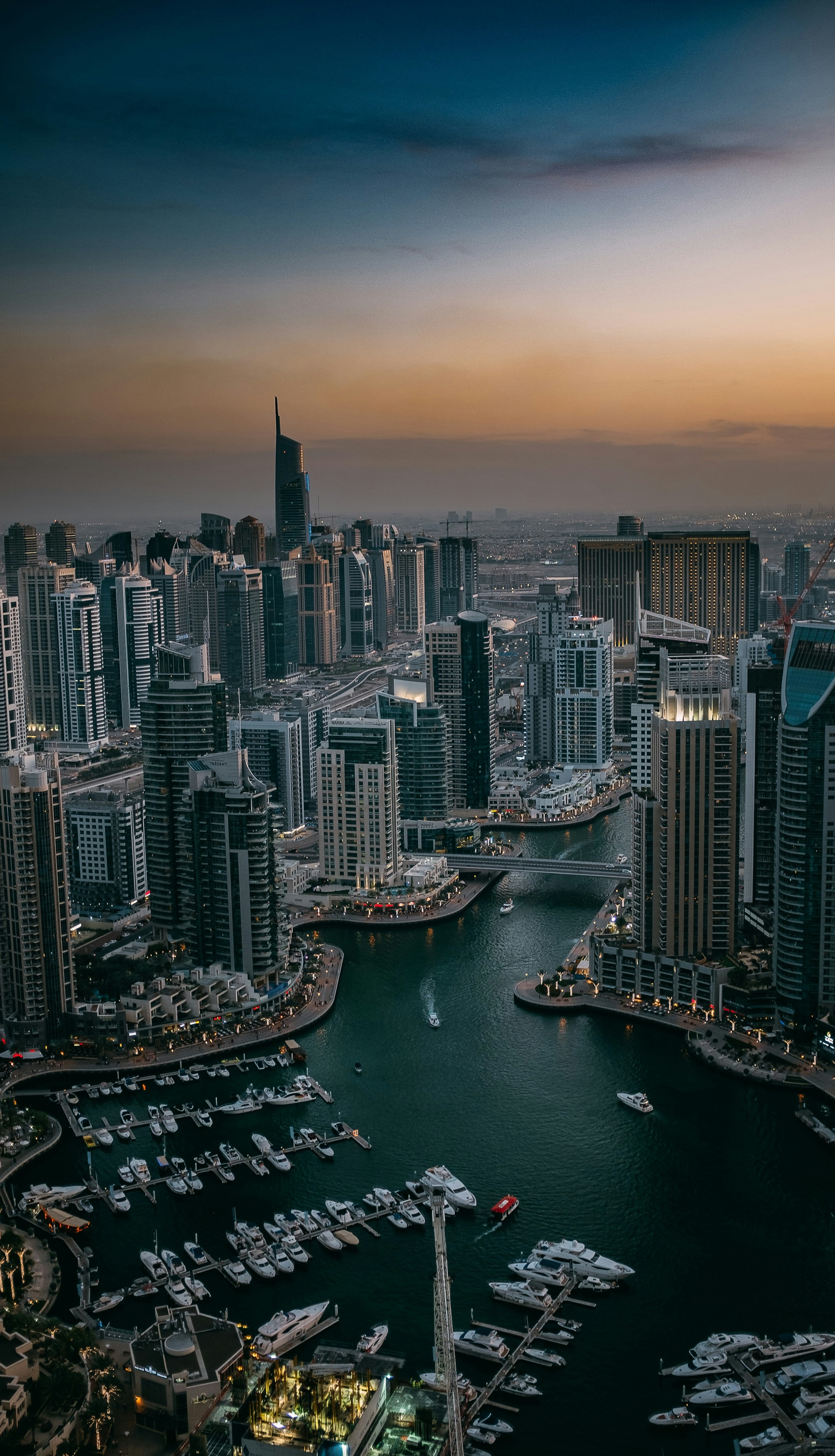 Dubai Marina towers and yacht berths at dusk