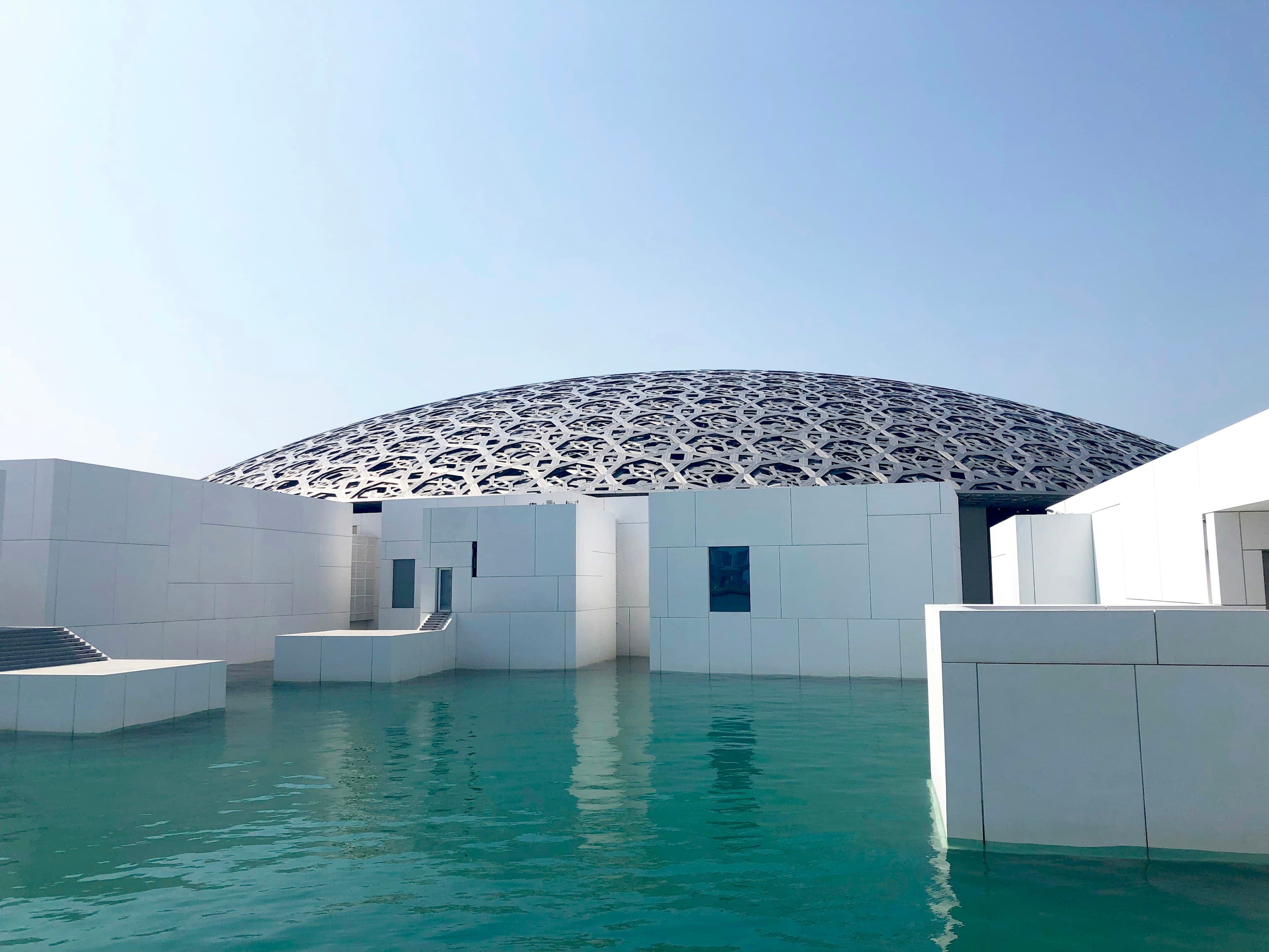 The Louvre Abu Dhabi dome beside the water on Saadiyat Island